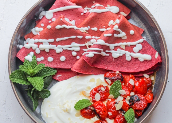 photo of Beetroot crepes with garlic labneh and pan-roasted cherry tomatoes